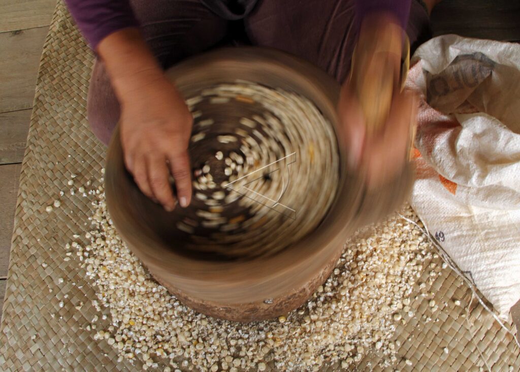 GRIND CORN TRADITIONALLY