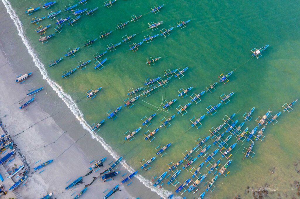 TETHERED FISHING BOATS AT PANGANDARAN BEACH